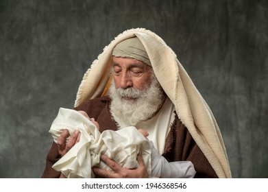 simeon-holding-baby-jesus-against-260nw-1946368546